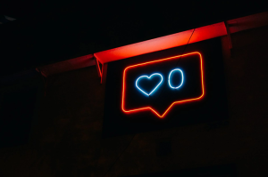neon sign featuring motifs used in PR & SM