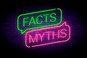 Facts and myths sign in glowing neon style.
