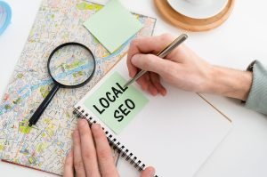 Hand writing Local SEO on note book