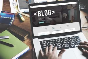 Laptop with the word blog written on screen.