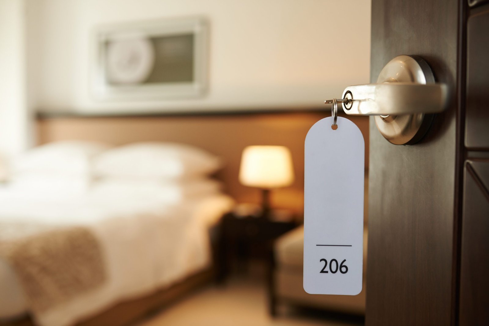 hotel key hanging out of room door. video production