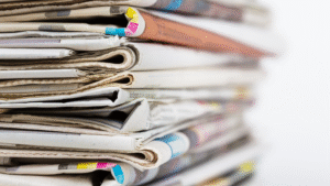 pile of folded newspapers